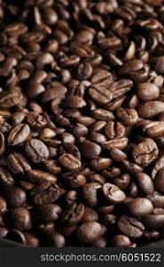 Fresh roasted coffee beans close-up background