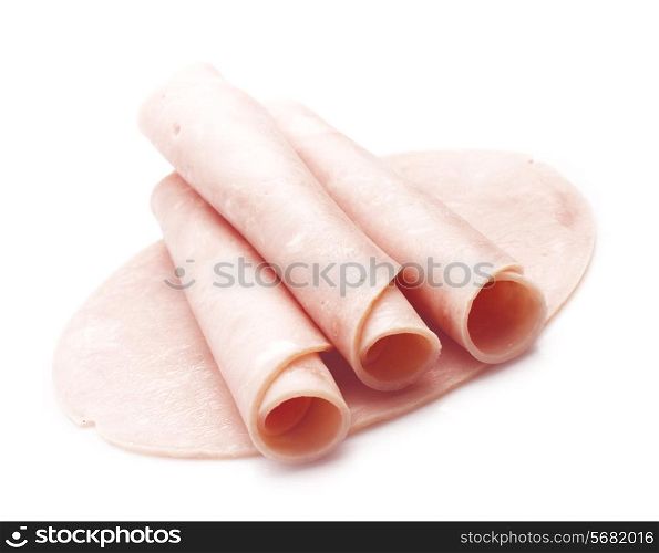 Fresh rolled ham slices isolated on white
