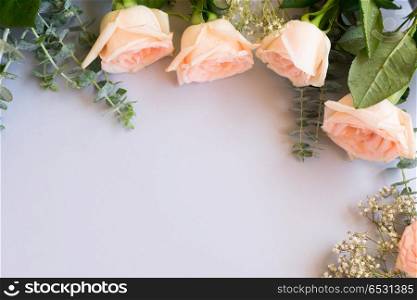 fresh rose flowers. Rose flowers on blue table from above with copy space
