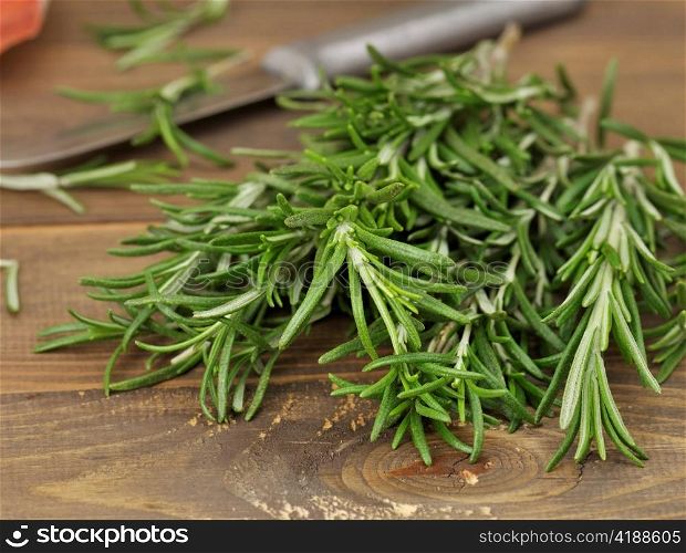 Fresh Rosemary Herbs On Wooden Background,Close Up