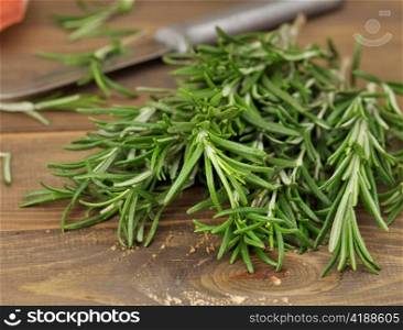 Fresh Rosemary Herbs On Wooden Background,Close Up