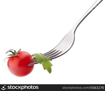 Fresh rucola salad and cherry tomato on fork isolated on white background cutout. Healthy eating concept.