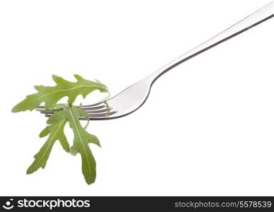 Fresh rucola salad on fork isolated on white background cutout. Healthy eating concept.
