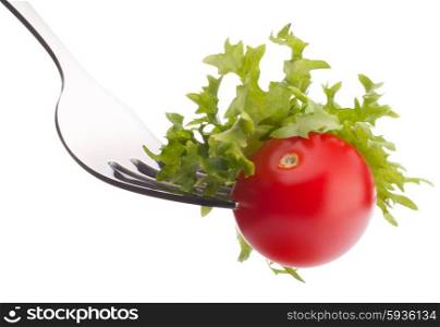 Fresh salad and cherry tomato on fork isolated on white background cutout. Healthy eating concept.