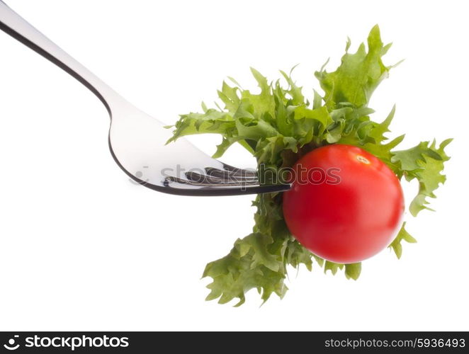 Fresh salad and cherry tomato on fork isolated on white background cutout. Healthy eating concept.