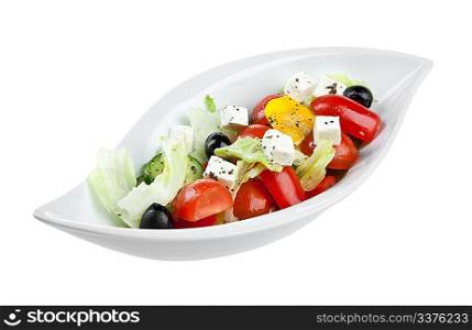Fresh salad from vegetables on the white