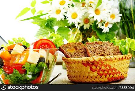 Fresh salad in a stylish white bowl. Isolated on white.