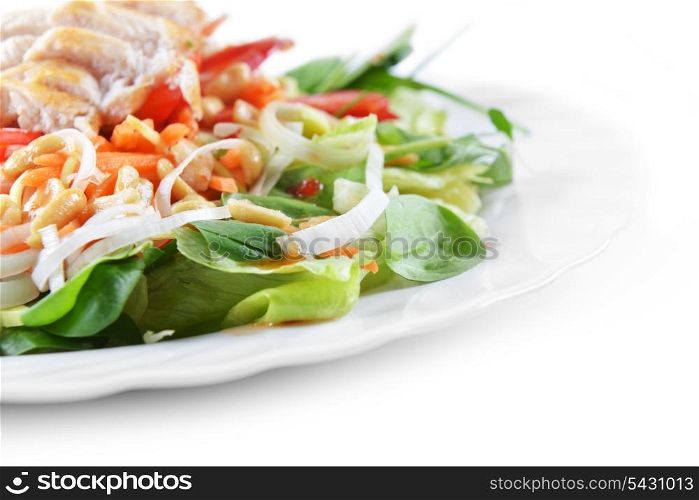 fresh salad of fried chicken, spinach and nuts