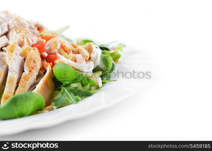 fresh salad of fried chicken, spinach and nuts