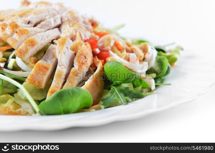 fresh salad of fried chicken, spinach and nuts