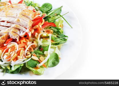 fresh salad of fried chicken, spinach and nuts