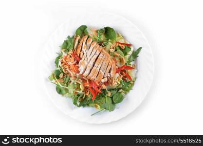 fresh salad of fried chicken, spinach and nuts