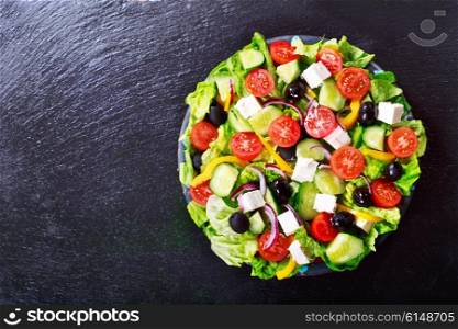 fresh salad on dark board