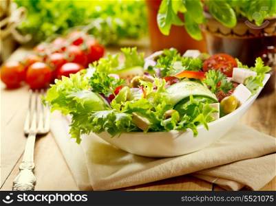 fresh salad on wooden table
