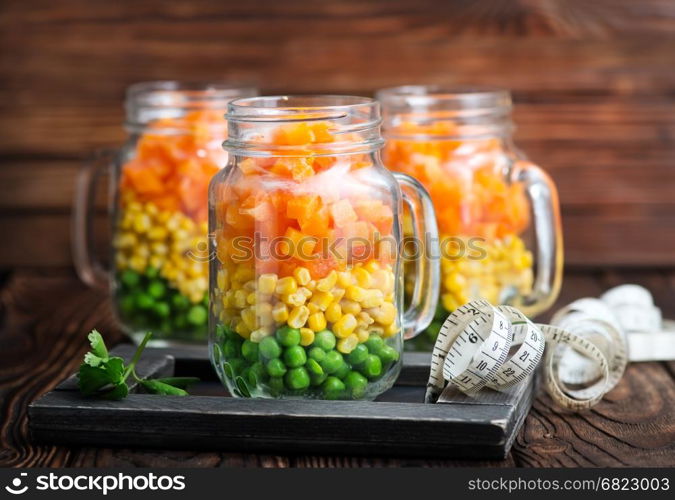 fresh salad with corn and green peas in bank