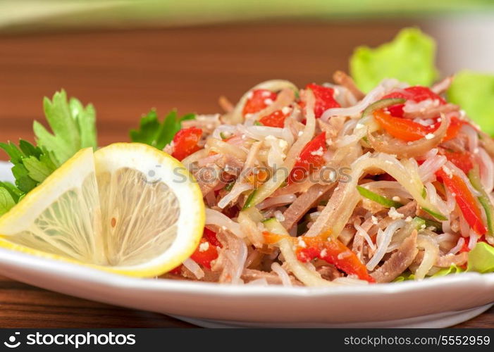 Fresh salad with funchozy, meat and vegetables