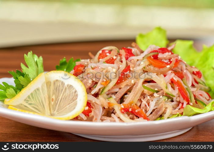 Fresh salad with funchozy, meat and vegetables