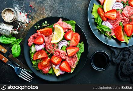 Fresh salad with hamon, blue cheese and strawberry