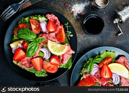Fresh salad with  hamon, blue cheese and strawberry 
