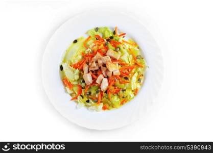 Fresh salad with lettuce, carrot and meat on dish