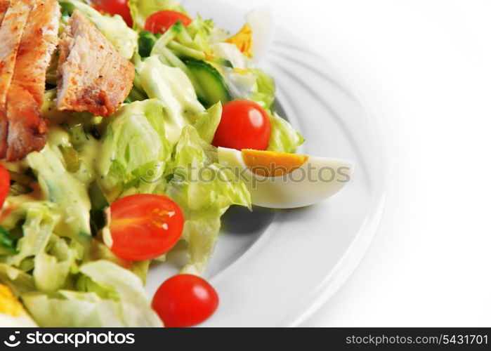 Fresh salad with lettuce, cherry tomato and meat on dish