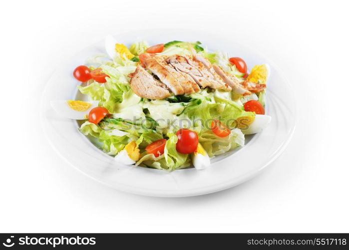 Fresh salad with lettuce, cherry tomato and meat on dish