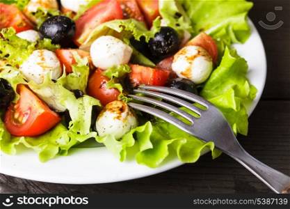 Fresh salad with mozarella cheese and vegetables