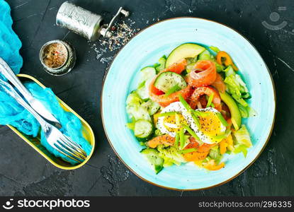 fresh salad with raw salmon avocado vegetables