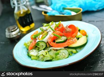 fresh salad with raw salmon avocado vegetables