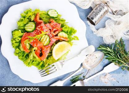 fresh salad with salmon on plate, diet food