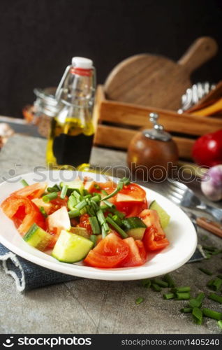fresh salad with tomato and cucumber on plate