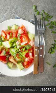 fresh salad with tomato and cucumber on plate