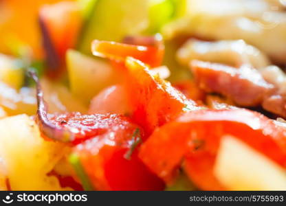 Fresh salad with tomato and fresh vegetable close up