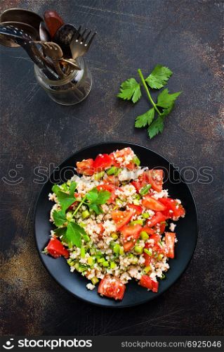 fresh salad with tomato and shrimps on the plate