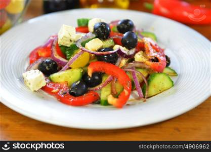 fresh salad with tomato, olives, pepper and other vegetables