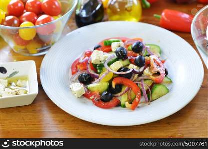 fresh salad with tomato, olives, pepper and other vegetables