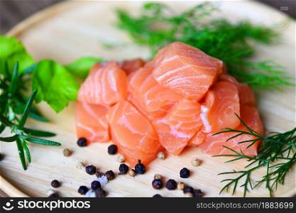 Fresh salmon fish for cooking salad seafood japanese food, Wasabi sauce raw salmon filet on wooden