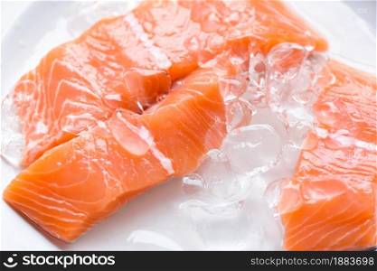 Fresh salmon fish on ice, Close up raw salmon filet seafood for sashimi