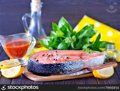 fresh salmon steak with pepper and salt