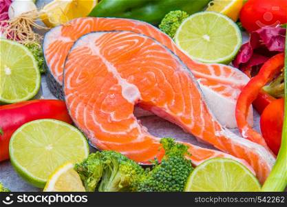 fresh salmon with fresh and colored vegetables ingredient