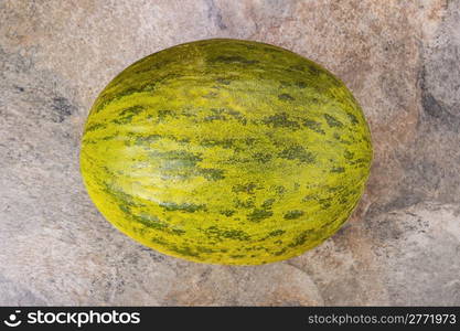 Fresh Santa Claus melon on natural stone background