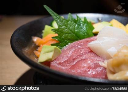 Fresh sashimi set in black bowl