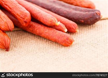 Fresh sausages on canvas background.