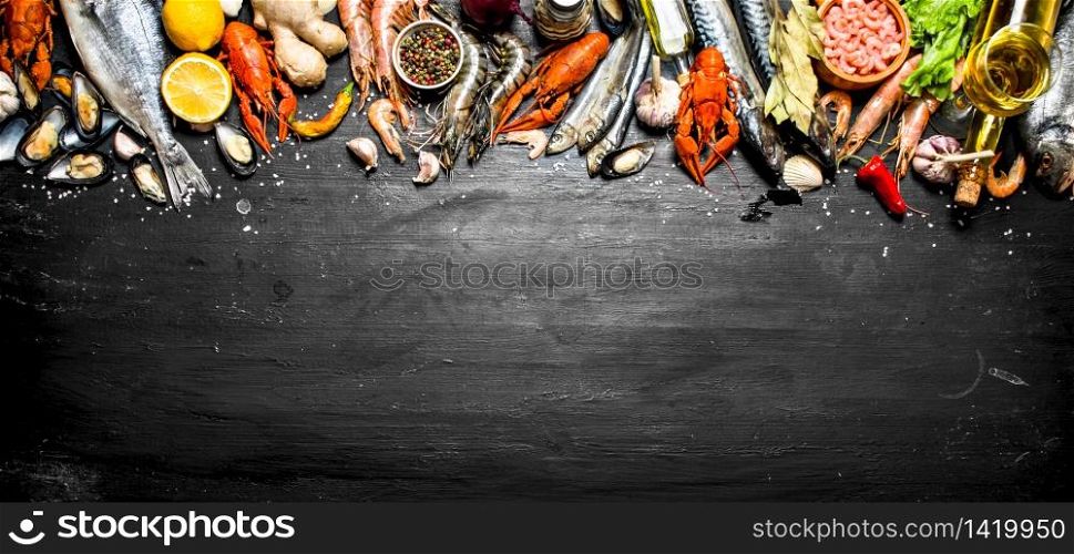 Fresh seafood. A wide range of shrimp, lobsters, octopus and other marine life. On a black chalkboard.. Fresh seafood.