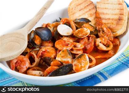 fresh seafood soup with roasted bread