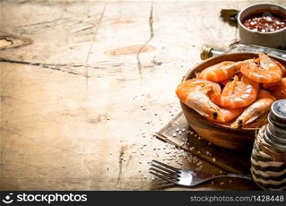 Fresh shrimp with sauce. On a wooden table.. Fresh shrimp with sauce.