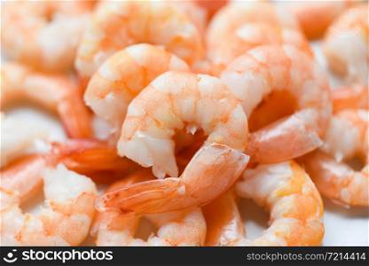 fresh shrimps served on plate / boiled peeled shrimp prawns cooked in the seafood restaurant