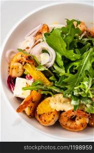 Fresh Sicilian Salad with shrimps, arugula, cheese and ripe orange slices
