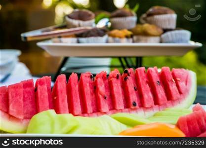 Fresh sliced watermelon at a spring festival picnic