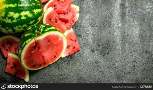 Fresh slices of watermelon. On a rustic background.. Fresh slices of watermelon.